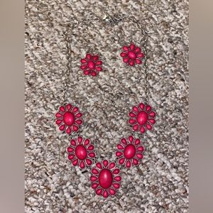 Flower necklace with matching earrings.
